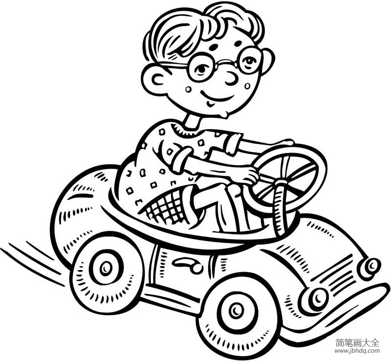 小男孩驾驶一辆玩具车