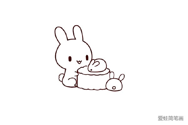 6.给两个小兔子画上耳朵和尾巴。