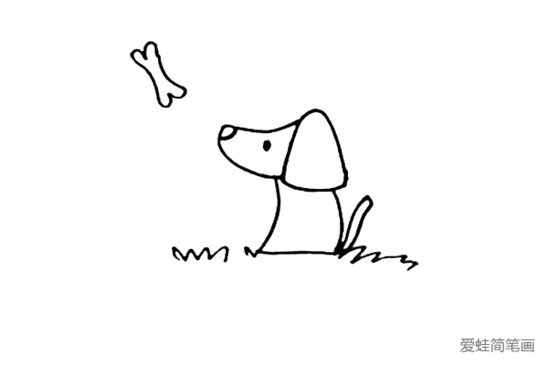 第四步：在小狗的正上方画上一根骨头，身体的下面画上草地。