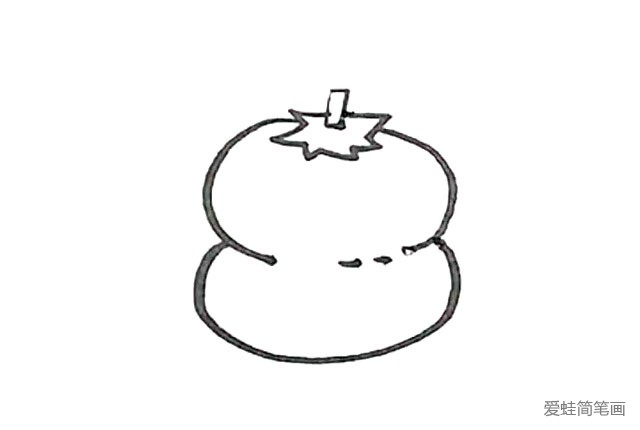 第四步：再接着下面，画上另一个椭圆形形成柿子的外形。