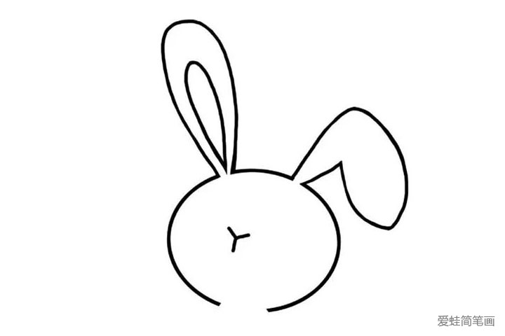 3.顺便把小兔子的三瓣嘴画上，一个小小的“Y”字就好了。