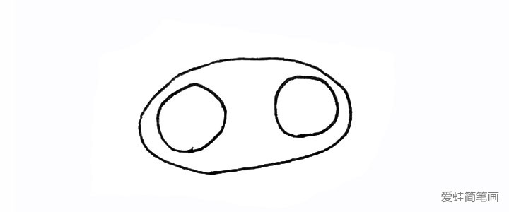 1.先画上有个椭圆形，里面画上两个圆。